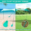 green pop up beach tent  with sand shovel