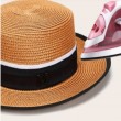 brown straw hat with metal letter